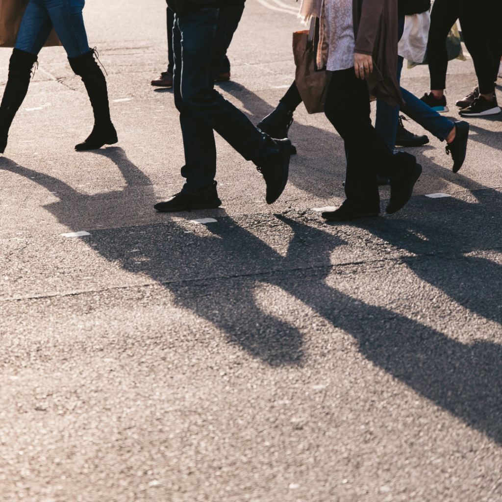 Group of people walking together, symbolising the broader social impact of baby loss on families and communities